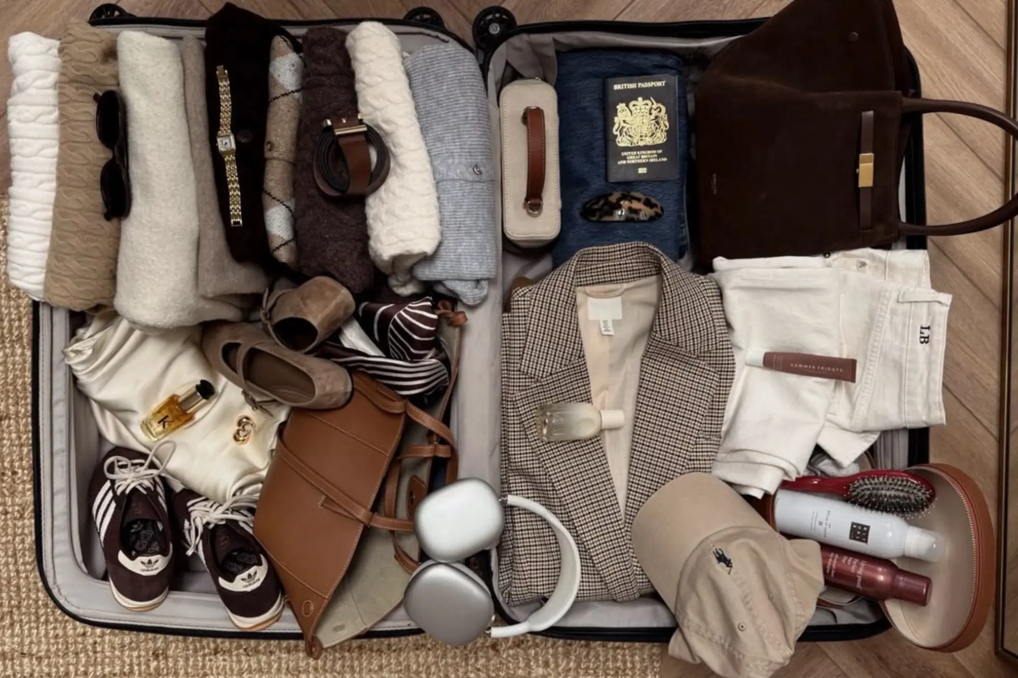 A luggage loaded with a diverse selection of clothing